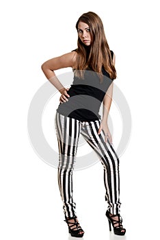 Teen girl wearing black white stripe pants