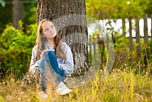 Teen-girl writing in a notebook