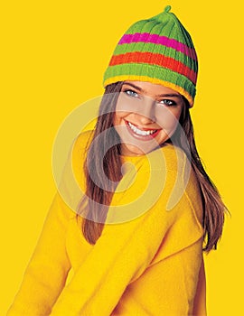 Teen girl in yellow winter clothes