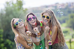 Teen girls blowing bubbles