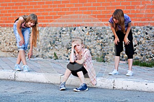 Teen girls in conflict at the school building