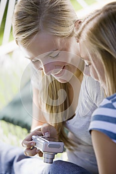 Teen girls with digital camera