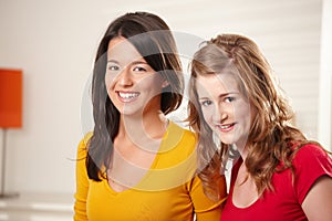 Teen girls smiling together