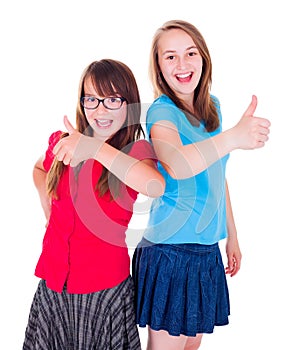 Teen girls standing and showing thumbs up