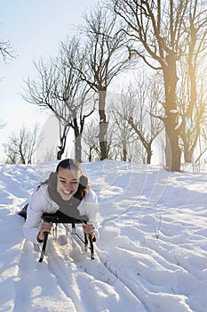 Teen having fun on sledge