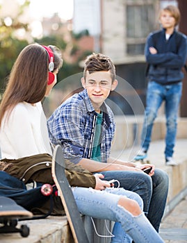 Teen and his friends after conflict outdoors