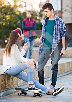 Teen and his friends after conflict outdoors