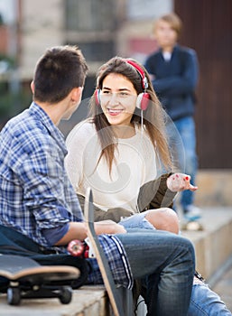 Teen and his friends after conflict outdoors