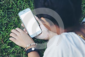 Teen holding smart phone