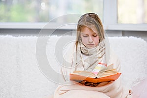 Teen ill girl reading a book