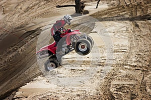 Teen jumping dunes