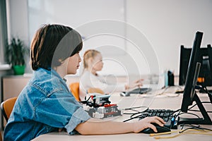 teen kids working together at machinery class, stem