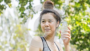 Teen lady hold plastic bottle of water