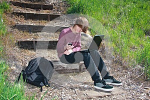 Teen with Laptop and Phone