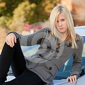 Teen Lying on top of Car