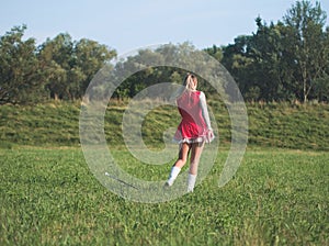 Teen Majorette Girl Twirling Baton Outdoors