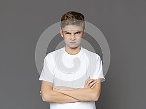 Angry teenager looking at camera with offence