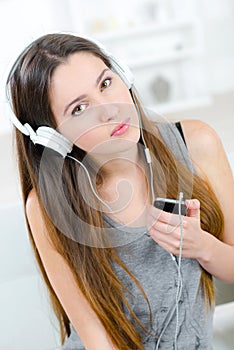 Teen with mobile and headphones