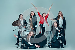 The teen music band performing in a recording studio