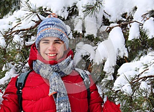 Teen near a snow-covered tree