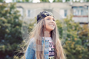 Teen in park enjoying the summer life smiling happily