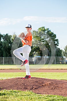 Teen Pitcher on Baseball Mound