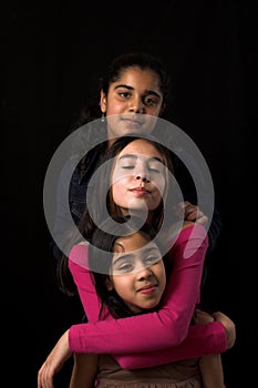 Teen posing over black backdrop