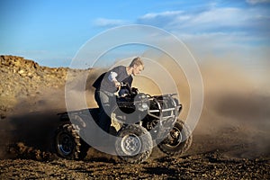 Teen on quad four wheeler