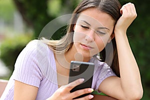 Teen reading phone content