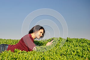 Teen reads sms and smiles