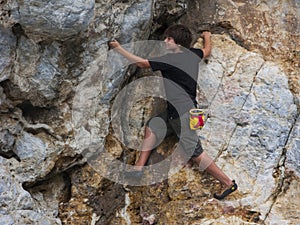 Teen rock climbing