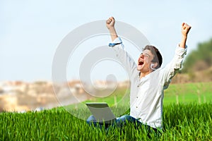 Teen shouting of joy outdoors.