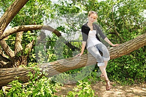 Teen sit on a branch