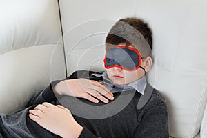 Teen sleeps during the day in mask for sleep