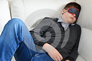 Teen sleeps during the day in mask for sleep