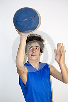 Teen sportsman holding basketball