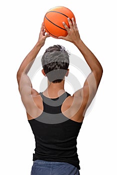 Teen sportsman with sportswear playing basketball. White background.