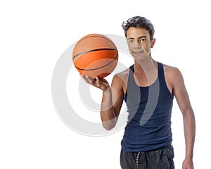 Teen sportsman with sportswear playing basketball. White background.