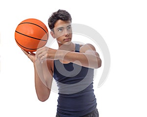 Teen sportsman with sportswear playing basketball. White background.