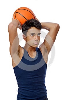 Teen sportsman with sportswear playing basketball. White background.