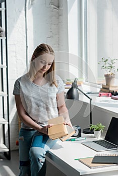 teen student girl with books sitting on work desk
