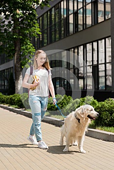 teen student girl with books walking