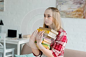teen student girl with stack of books