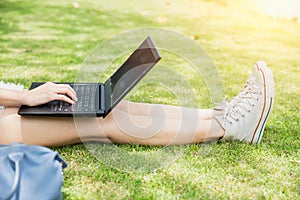Teen student working with computer laptop outdoor university campus