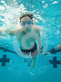 Teen swimming freestyle