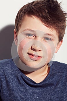 Teen, thinking and face of boy in studio or white background with a dream of future and vision. Kid, relax and wonder