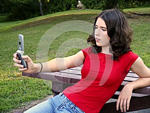 Teen using camera phone