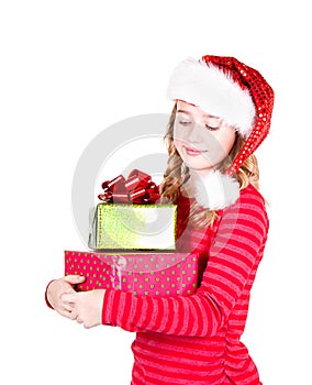 Teen wearing Santa hat holding Christmas presents