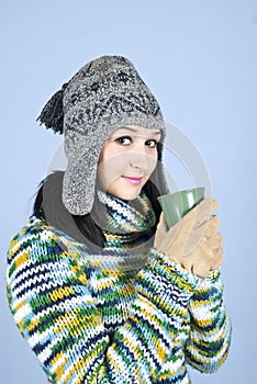 Teen winter girl with hot drink