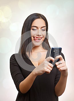 Teen woman having fun with mobile phone